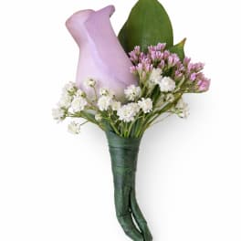 Lavender calla lily boutonniere with small white blooms and green wrapped stem