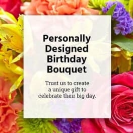 Colorful bouquet with a birthday message card in the center