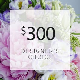 Purple and white flowers with a $300 designer's choice label
