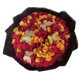 Bouquet of red and yellow roses with butterfly decorations