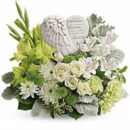 White and green sympathy arrangement with a memorial stone