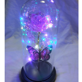 Purple light-up rose in a clear dome with a butterfly decoration
