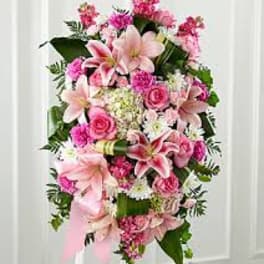 Pink and white floral standing spray with lilies and roses