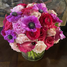 Bouquet of pink and purple flowers in a glass vase