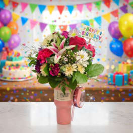Birthday bouquet in a pink tumbler with a Happy Birthday sign