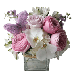 Pink and white flower arrangement in a square glass vase with a purple butterfly accent