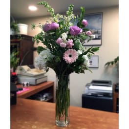 Pink and white mixed bouquet in a clear glass vase