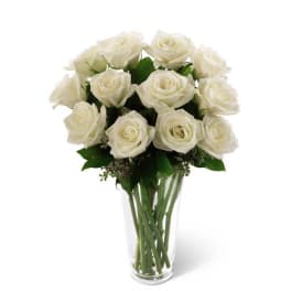 Bouquet of white roses in a clear glass vase