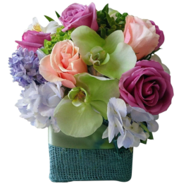 Bouquet of pink and lavender flowers in a square vase