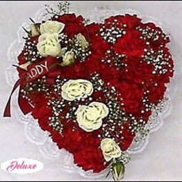 Heart-shaped bouquet of red carnations with white roses and baby's breath