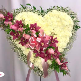 Heart-shaped floral spray with white blooms and pink orchids