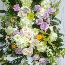 Large bouquet of lavender and white roses with pale hydrangeas