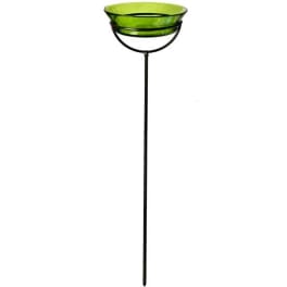 Green glass bowl on a tall black metal stand