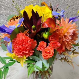 Colorful bouquet of mixed flowers in a glass vase
