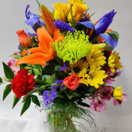 Colorful mixed bouquet in a clear glass vase