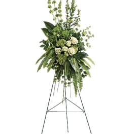 Tall white rose floral spray on a standing easel
