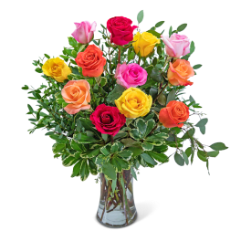 Mixed-color roses arranged in a clear glass vase