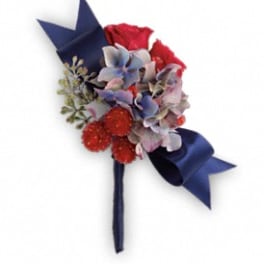 Small bouquet with red and blue flowers tied with a dark ribbon