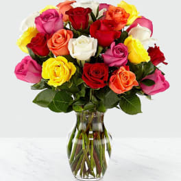 Mixed roses in a clear glass vase