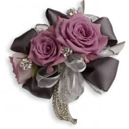 Small bouquet of purple roses with silver and black ribbon