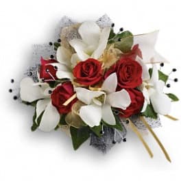 Red roses and white calla lilies in a compact bouquet