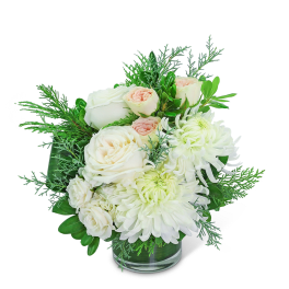 White roses and chrysanthemums in a clear glass vase