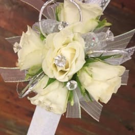 White rose wrist corsage with silver ribbon and clear accents