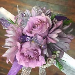Lavender rose bouquet with purple daisies and glittery butterfly accents