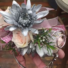 Silver flower corsage with a pale rose and pink ribbon