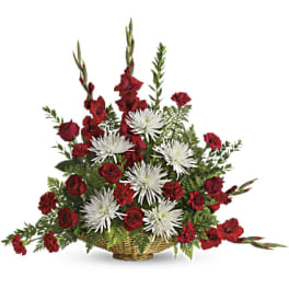Basket arrangement of red roses and white spider mums