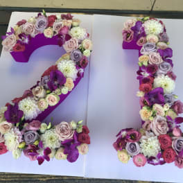 Floral number 21 made of pink, purple, and white flowers