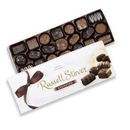 Box of assorted chocolates with a white ribboned lid