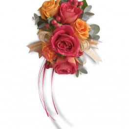 Pink and orange rose bouquet with ribbon and berries