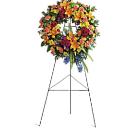 Colorful funeral wreath on a standing easel