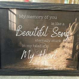 Framed memorial sign with the words "My memory of you is like a Beautiful Song"