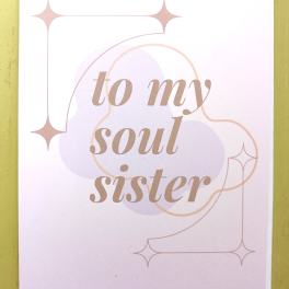 Greeting card reading 'to my soul sister' in tan script with pastel shapes and star accents.