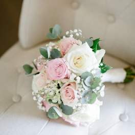 Small bouquet of pink and white roses with eucalyptus