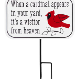 Yard sign with a red cardinal and memorial text