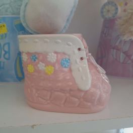 Pink ceramic baby bootie with colorful flower accents