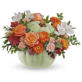 Pumpkin-shaped vase with orange and white flowers