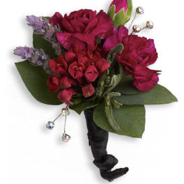 Small bouquet of magenta and red flowers with jeweled accents