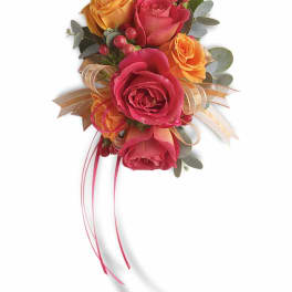 Hand-tied bouquet of pink and orange roses with ribbon