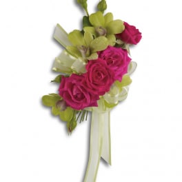 Pink rose corsage with green orchids and ribbon