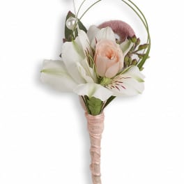 Small boutonniere with white and blush flowers and pearl accents