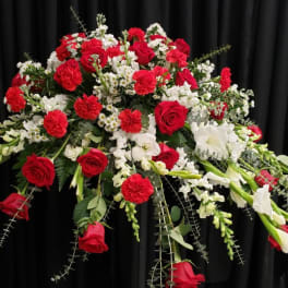 Large red and white floral spray with roses and carnations