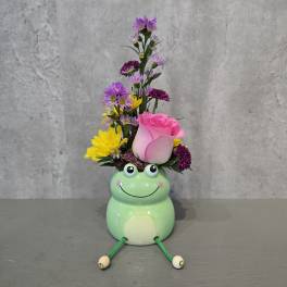 Pink rose and mixed daisy bouquet in a frog-shaped vase