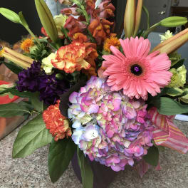 Colorful mixed bouquet with gerbera daisy, hydrangea, lilies, and snapdragons