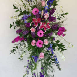 Tall standing floral spray with pink, purple, blue, and white flowers