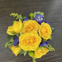 Yellow rose bouquet with purple flowers and green accents