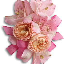 Pink and peach floral corsage with ribbon
